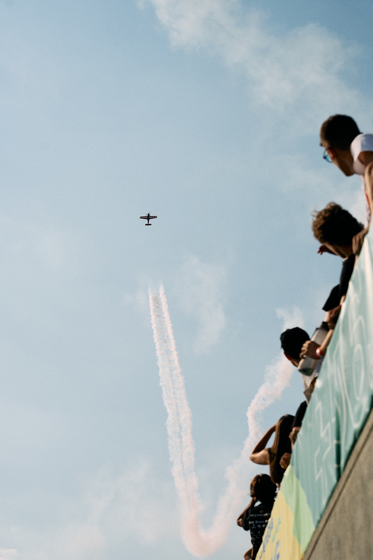 Spectators watching aerobatic display